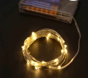 Гирлянда роса 100 LED на батарейках  10м белый теплый Желтый Unison (1978-07)